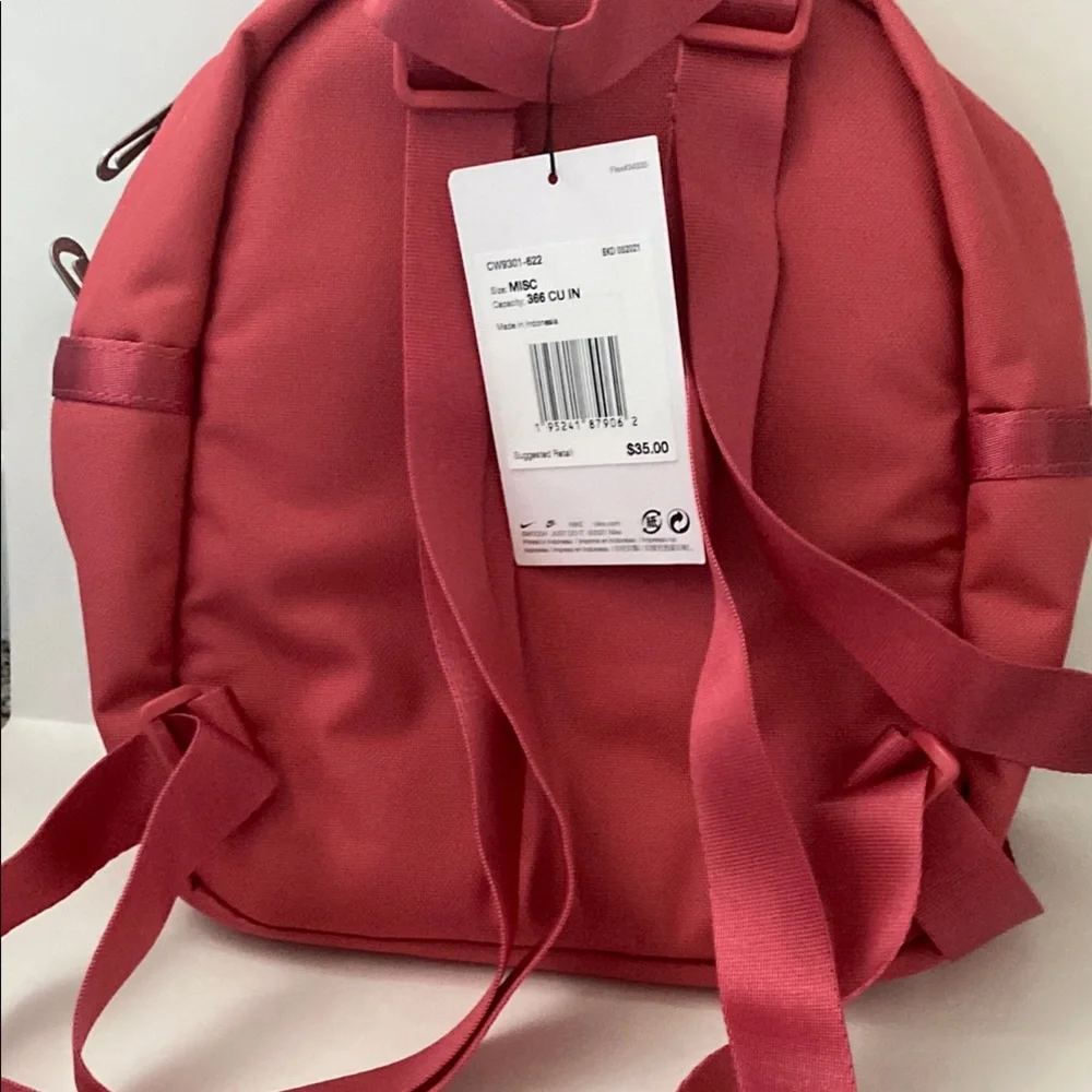 Nike Pink Futura 365 Mini Backpack. Size 10x8x4 inches. Gold Nike Swoosh. NWT